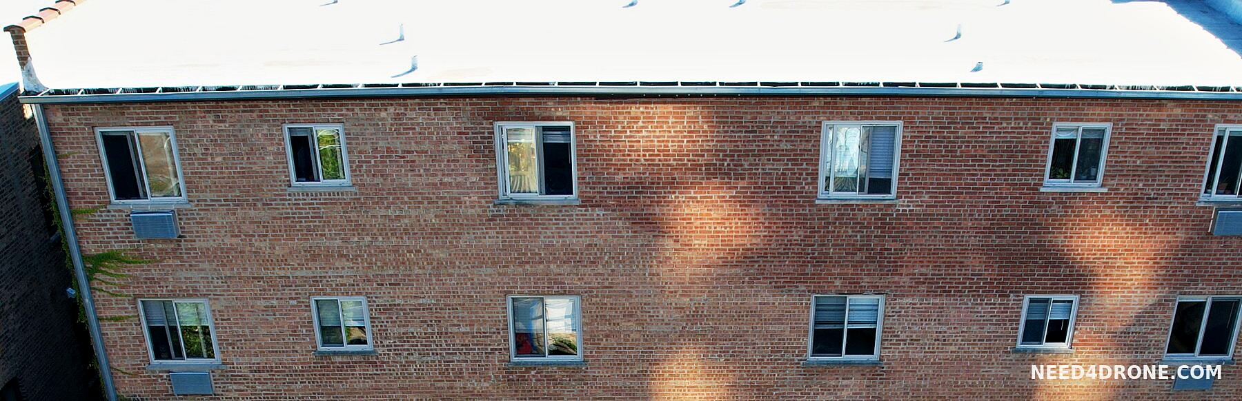 Metal gutter along the rear roof edge