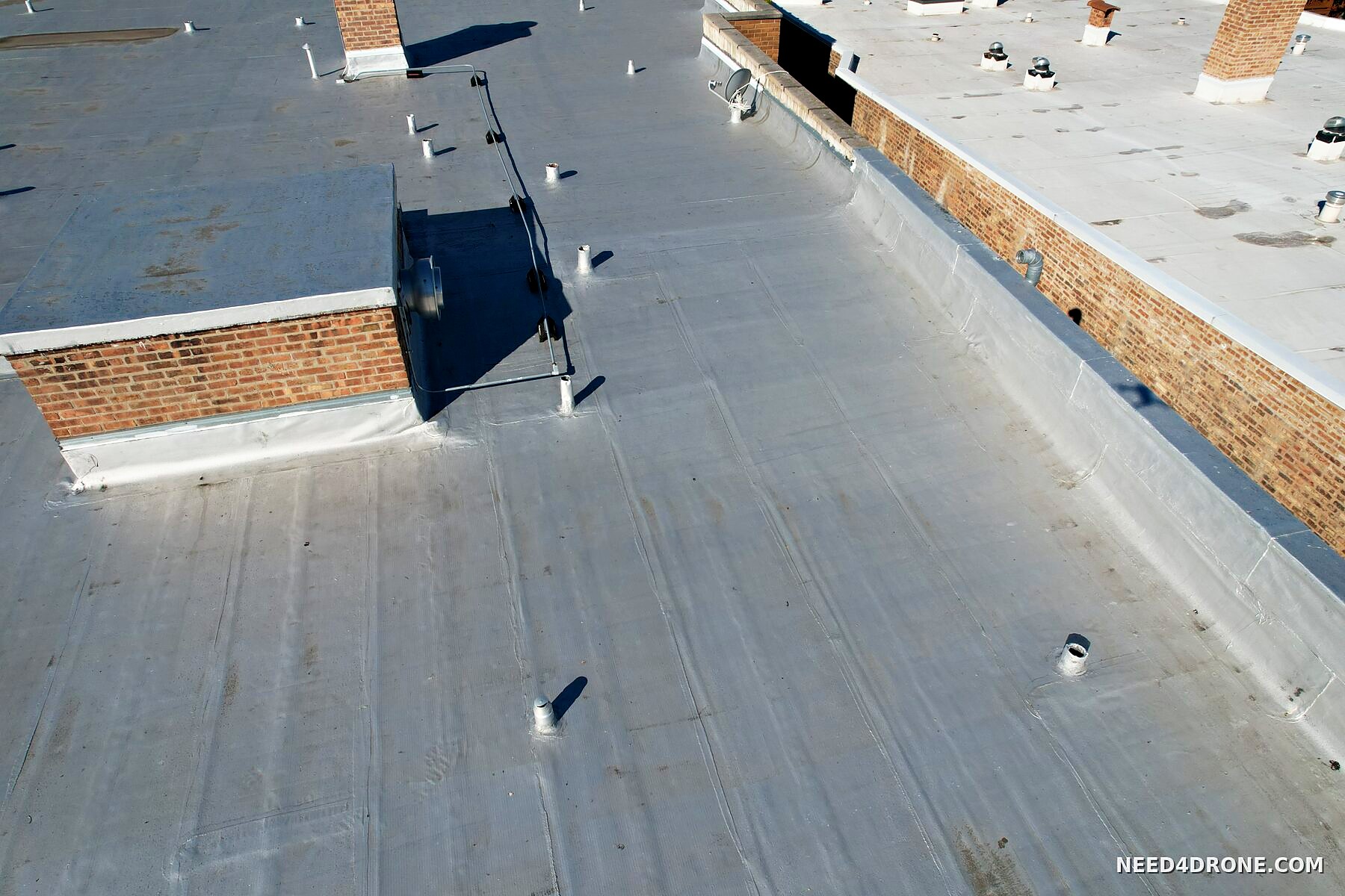 Parapet and curb flashing on the roof